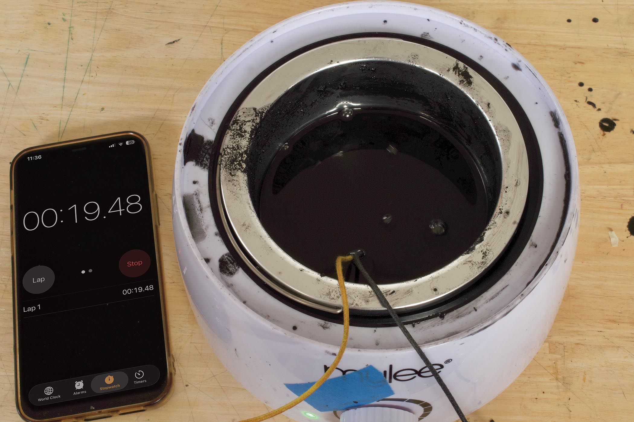 Black wax is heated to 60&amp;deg;C and the pickup is lowered in for potting