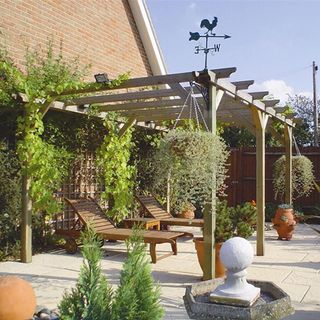 patio area with wooden pergola and seating