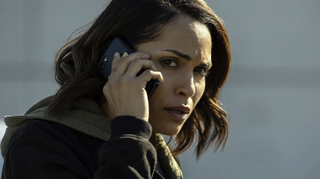 Jackie Quiñones (played by Monica Raymund) holds a smartphone to her ear in Hightown season 3