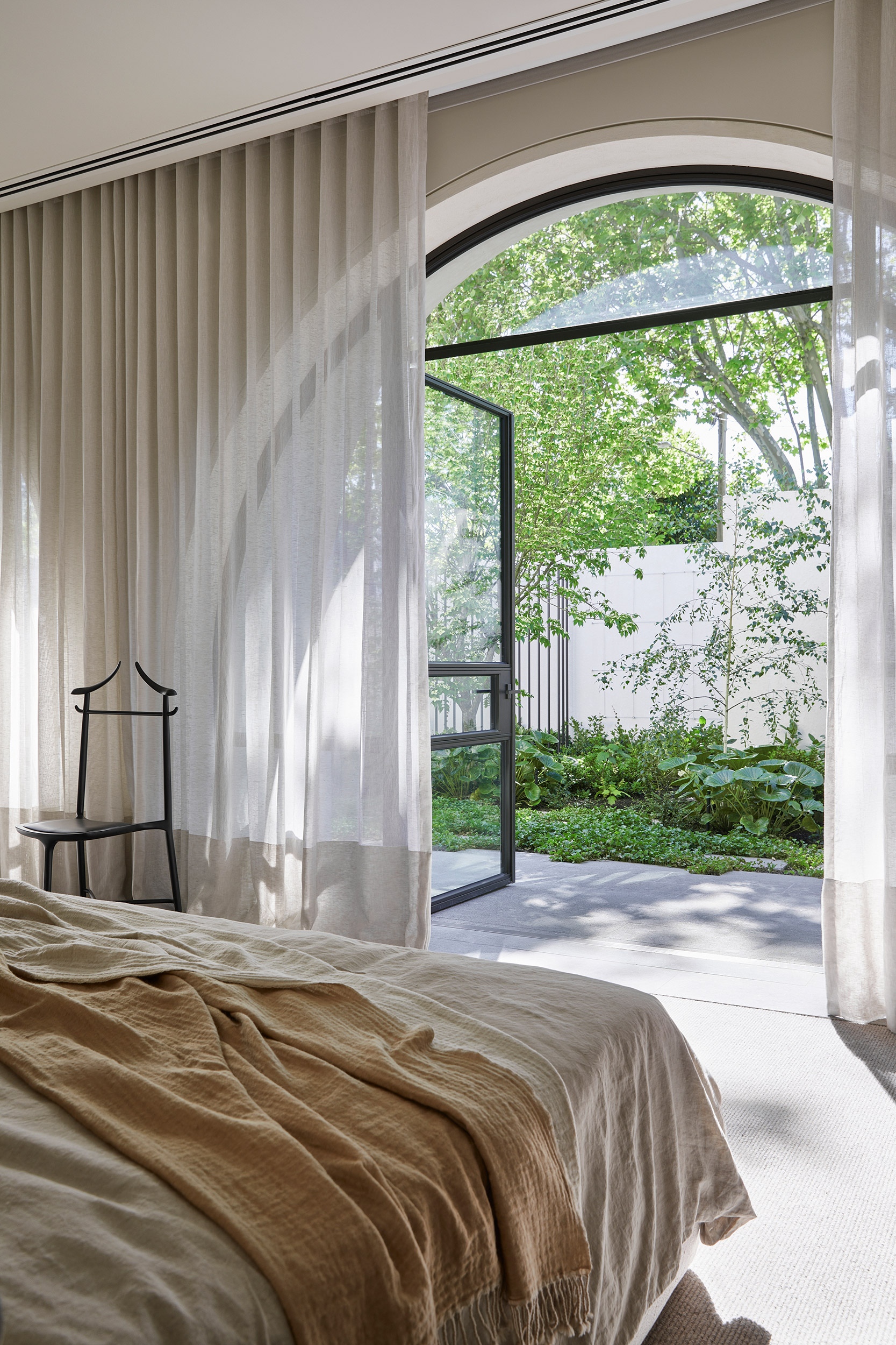 Bed room with linen curtains