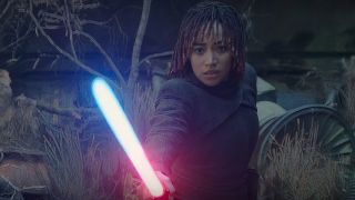 Osha holds Sol's lightsaber as its blade changes from blue to red in The Acolyte episode 8