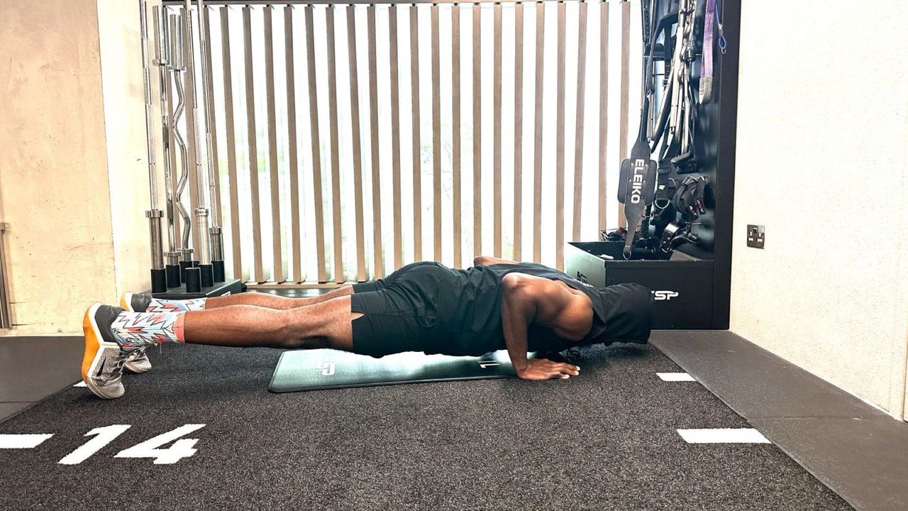 Lewis Paris performs a press up