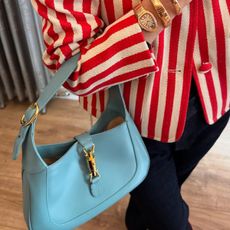 An image of the Gucci Jackie bag in light blue.