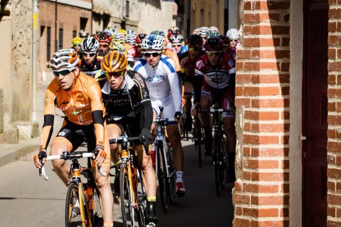 Tom Soladay near the front as the peloton navigates an extremely narrow corridor in stage 2 at the Vuelta a Castilla y Leon
