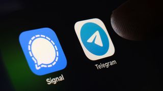 The app icons of Signal and Telegram on a smartphone
