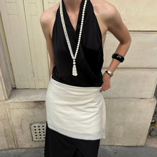 Influencer wearing black and white outfit.