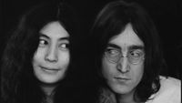 John Lennon and Yoko Ono look at each other in 1968.