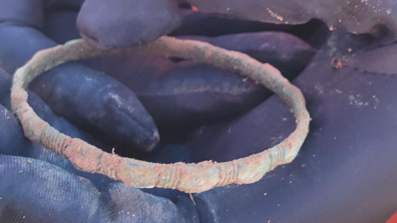 A weathered copper bangle