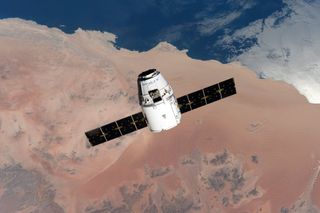 A SpaceX Dragon cargo ship is seen approaching the International Space Station on April 10, 2016. A new Dragon will launch to the station on July 18.