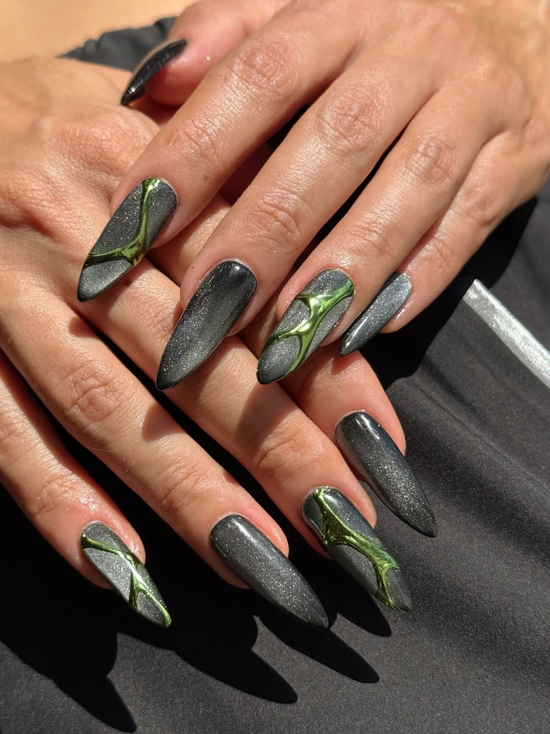 gray and green cat eye and chrome manicure
