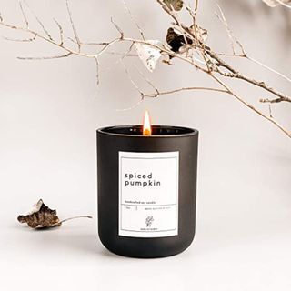 Pumpkin-spiced candle in black 