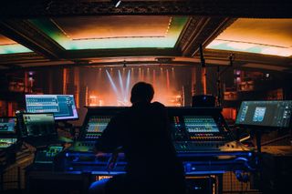Sam Perrignon and his Quantum338 desk at FOH during a performance by Tash Sultana and their band.