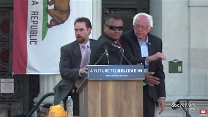 Secret Service agents surround Bernie Sanders during Oakland rally