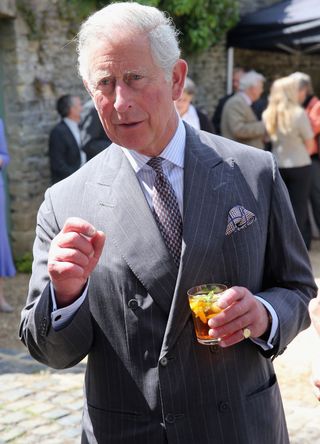 King Charles with a cocktail