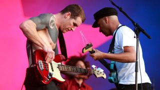 Tim Commerford and Tom Morello of Rage Against The Machine perform at day 2 of the Download Festival at Donington Park on June 12, 2010 in Castle Donington, England.