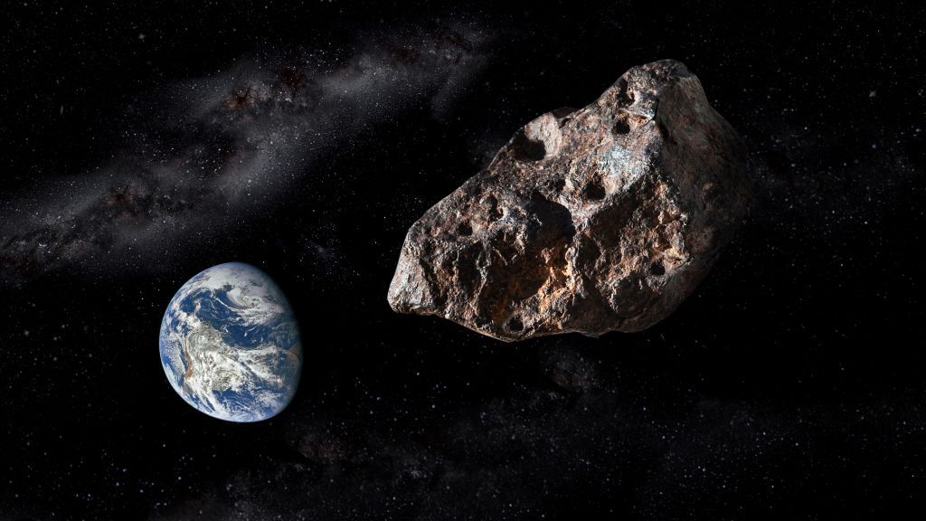 An artist&#039;s depiction of an asteroid flying past Earth.