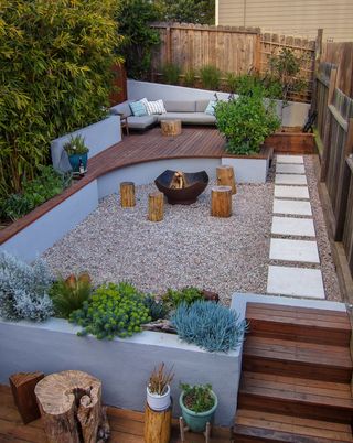a large curved deck in a narrow garden