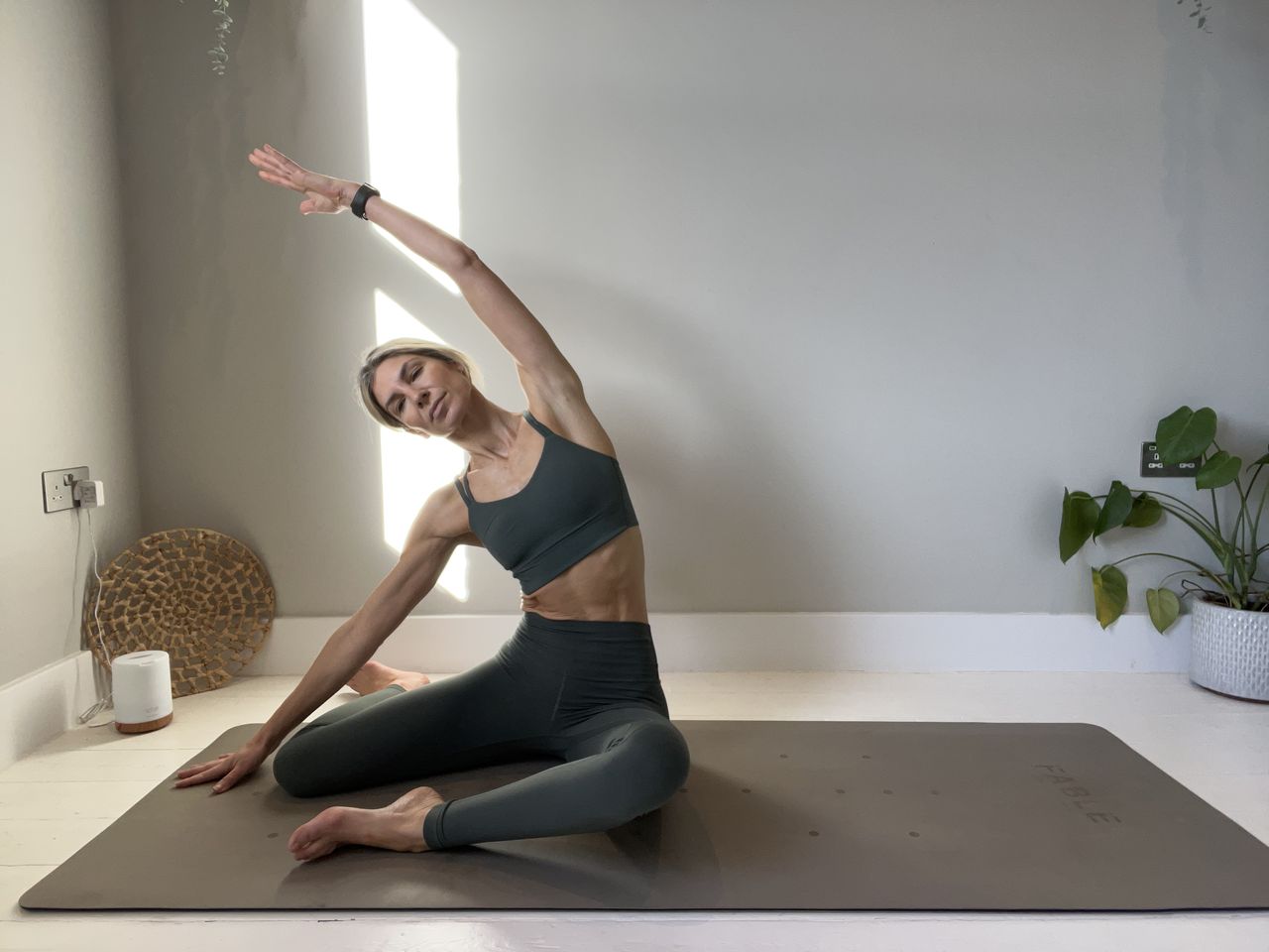 Pilates instructor Gemma Folkard demonstrating the mermaid