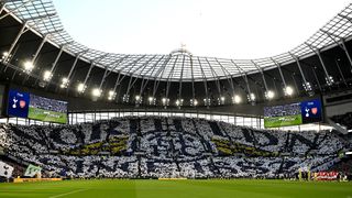 View of the South Stand at Tottenham Hotspur Stadium, with fans holding up a TIFO which reads "North LDN Since 1187".