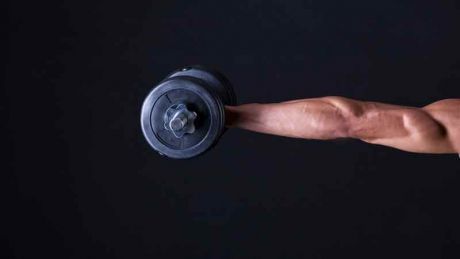 man holding dumbbell