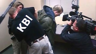 a still from the documentary predators of a man being arrested and a camera crew filming it