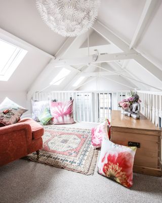 Mezzanine area with floral cushions and pink theme