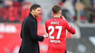 Xabi Alonso and Bayer Leverkusen playmaker Florian Wirtz