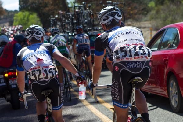 Hagens Berman riders passing out the water.