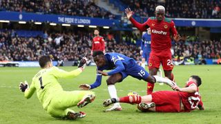 Nicolas Jackson of Chelsea is tackled by Maximillian Kilman of Wolverhampton Wanderers as he goes through on goal during the Premier League match between Chelsea FC and Wolverhampton Wanderers at Stamford Bridge on February 3, 2024 in London, England.