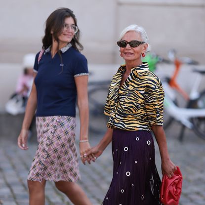 Grece Ghanem and her daughter holding hands