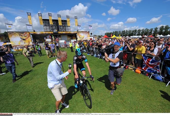 Reporters grab a quick interview with Chris Froome in Cambridge