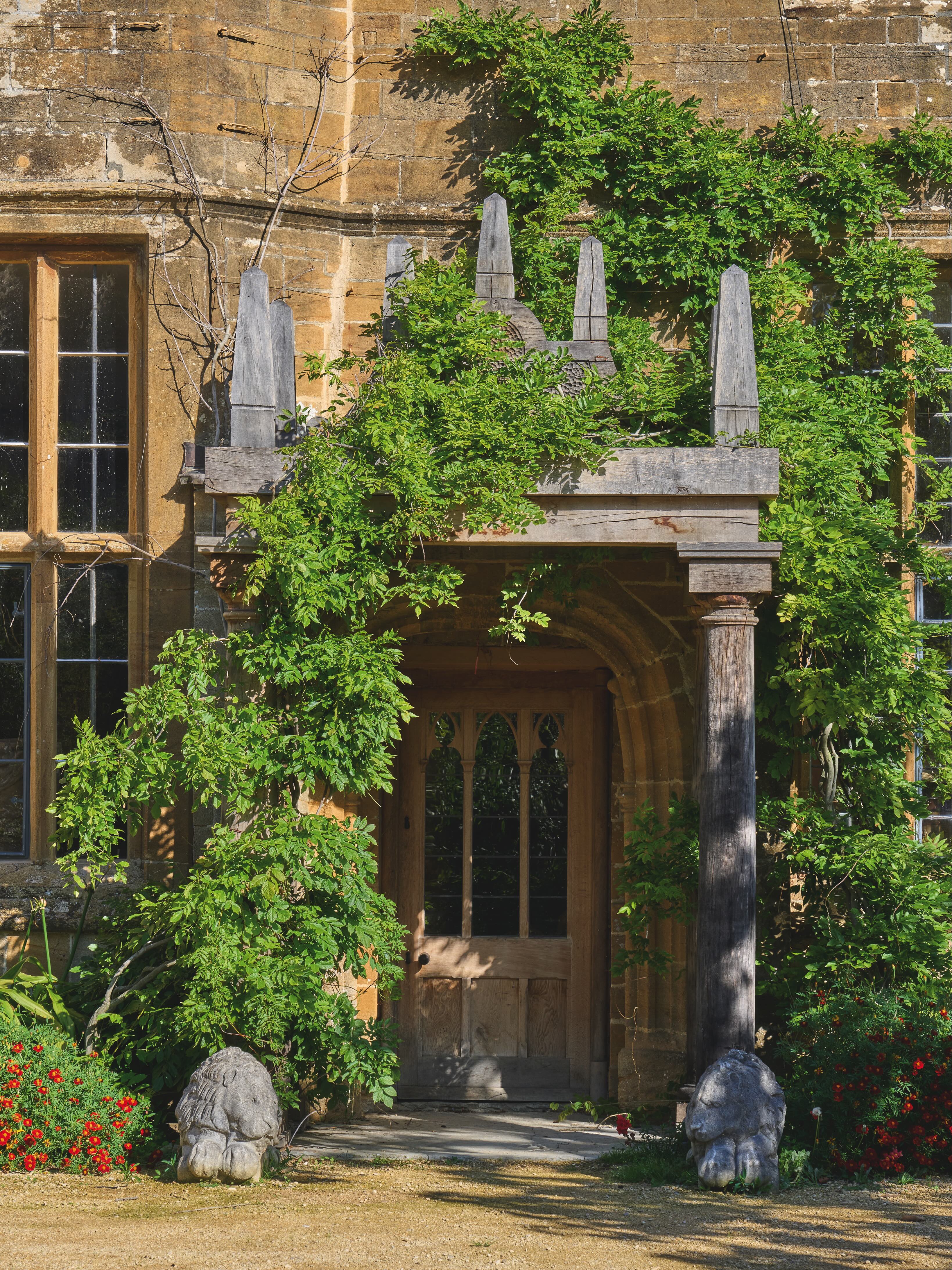 The front porch of the home, clad in ivy.