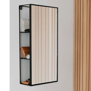 Umbra Cubiko Mirror and Cabinet hanging on wall with mail, purse and keys hidden behind it