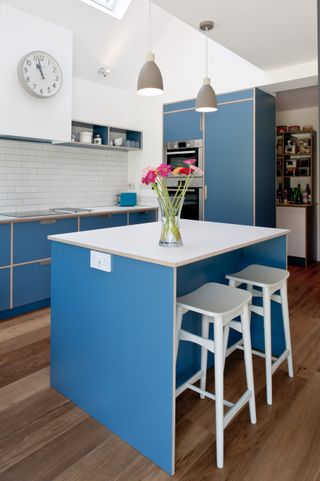 blue kitchen with small island breakfast bar