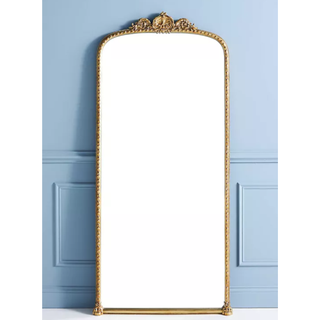 Ornate vintage-inspired floor mirror.