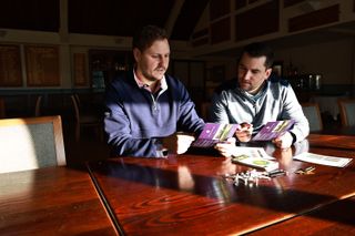 Players signing golf scorecards