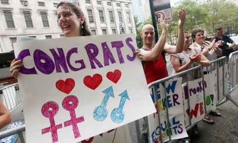 Gay marriage supporters cheer outside the Brooklyn City Clerk&amp;#039;s office on July 24th, 2011, the first day gay couples were allowed to legally marry in New York.