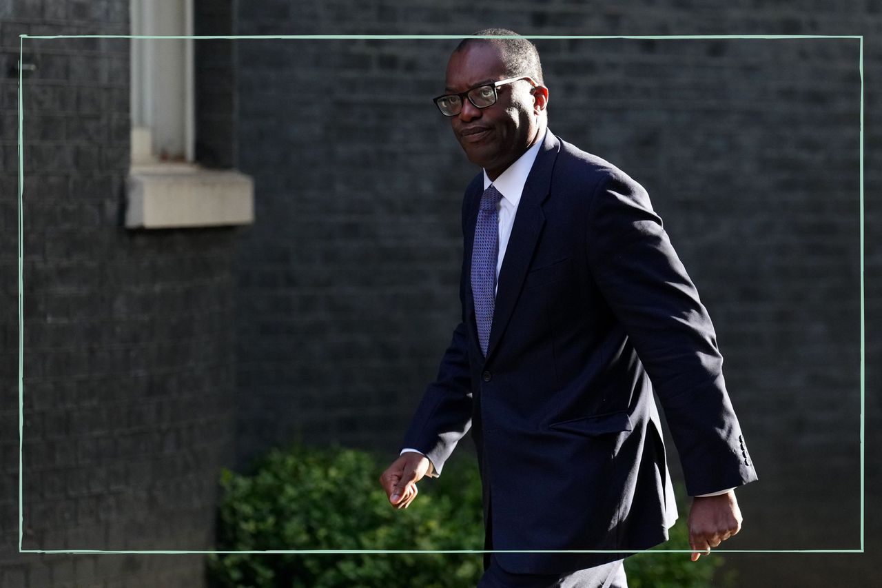 Chancellor Kwasi Kwarteng walking down the street