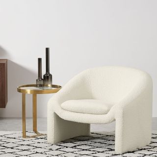 MADE Shona Accent Armchair in cream in living room atop rug
