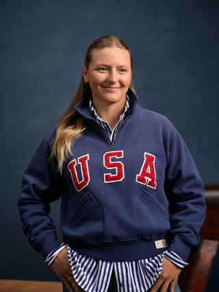 Daniela Moroz wears a Ralph Lauren Team USA jacket and half-zip sweater
