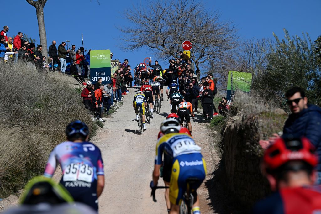 BAEZA SPAIN FEBRUARY 13 A general view of Ivan Romeo of Spain and Movistar Team Alex Colman of Belgium and Team FlandersBaloise Matis Louvel of France and Team Arka Samsic Luis Angel Mate of Spain and Team EuskaltelEuskadi and Ibon Ruiz of Spain and Team Equipo Kern Pharma and the peloton competing in Ubeda while fans cheers during the 2nd Clasica Jaen Paraiso Interior 2023 a 1789km one day race from beda to Baeza 752m ClsicaJan23 on February 13 2023 in Baeza Spain Photo by Dario BelingheriGetty Images