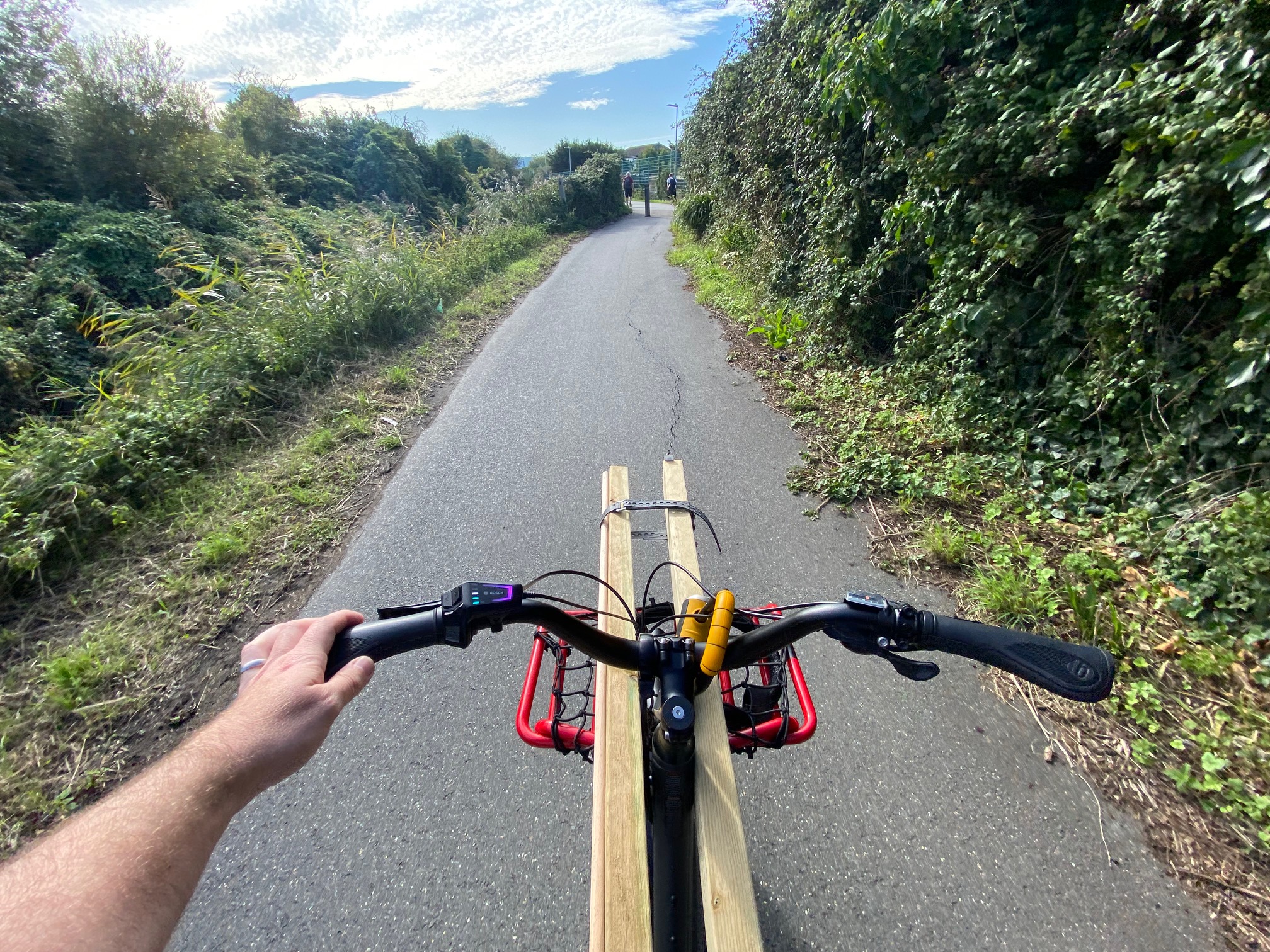 riding a clear cycle path on a benno remidemi cargo bike.