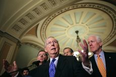 Senate Majority Leader Mitch McConnell talks to reporters.