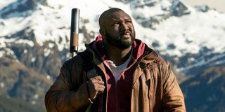 nonso anozie's jeppard standing in front of a mountain on sweet tooth