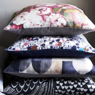 piled squared shape designed pillows