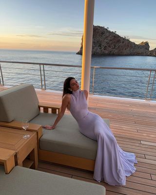 Kendall Jenner on a boat in mallorca spain wearing a semi sheer dress