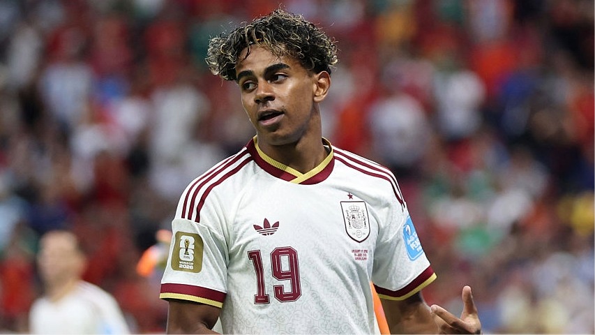 Lamine Yamal, wearing white, of Spain looks to his right during his side's World Cup 2026 campaign.
