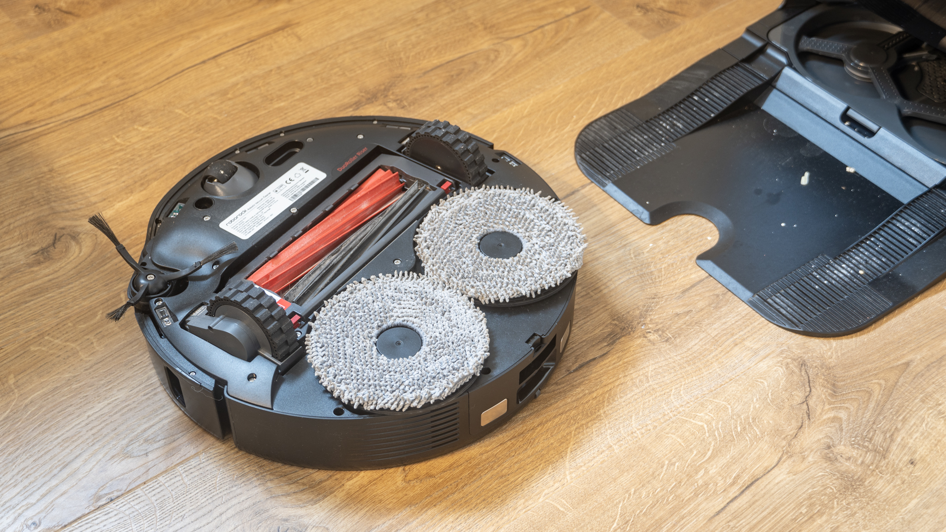 Roborock Qrevo Slim robot vacuum flipped over to show underside