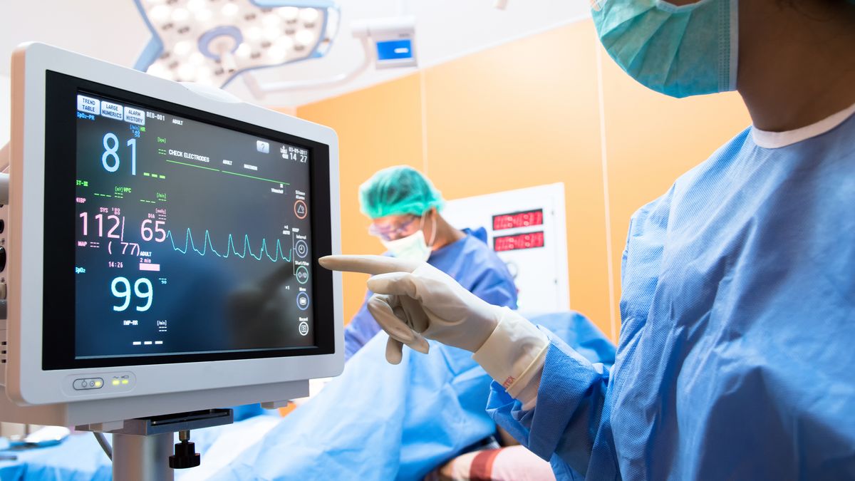 A heartbeat monitor displayed inside an operating room