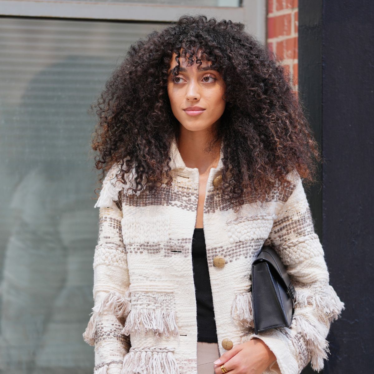 woman with curly hair street style shot - best shampoo for curly hair